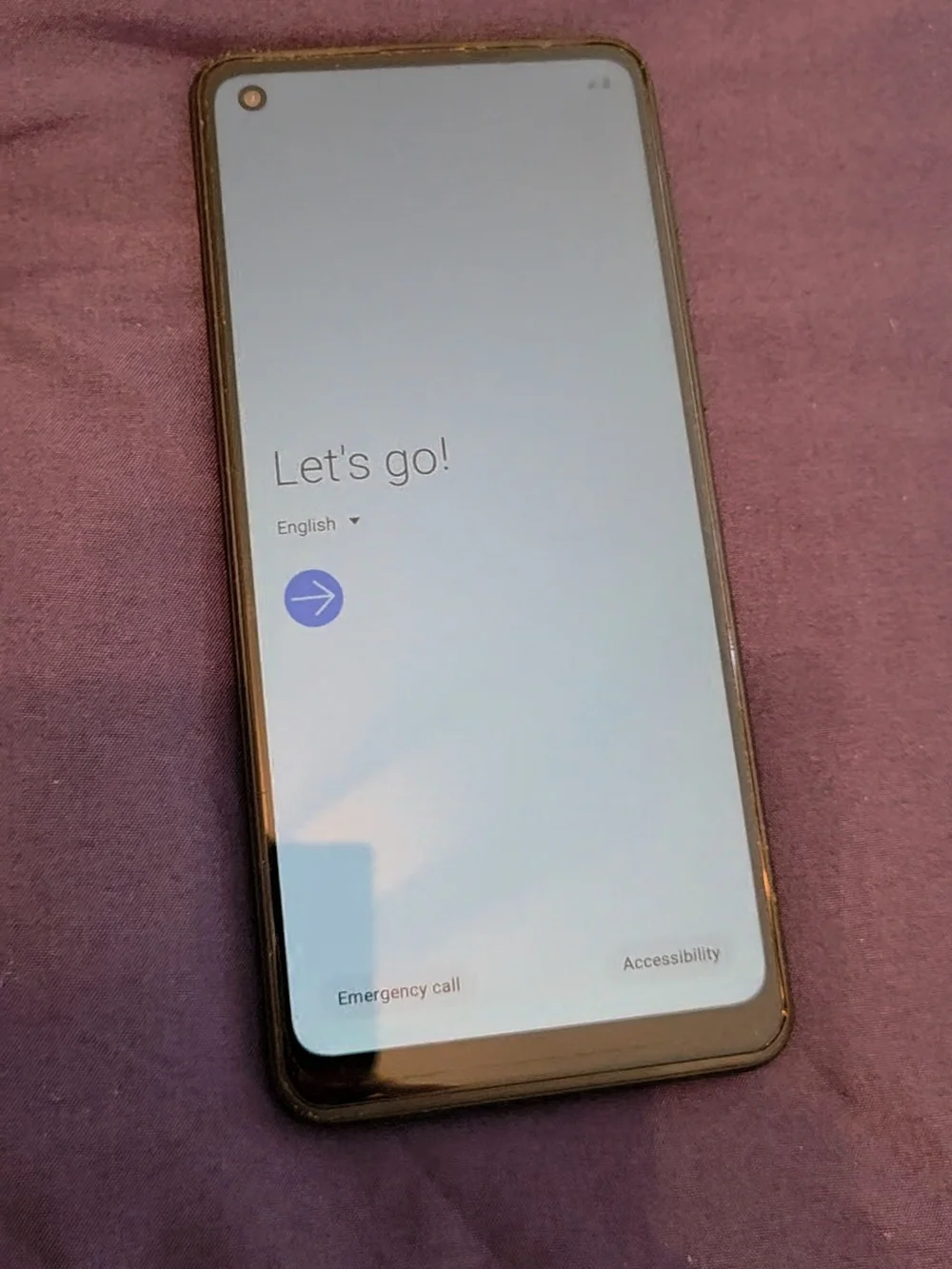 Samsung Smartphone with Black Case on Purple Surface